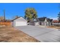 Detached garage with new doors, providing ample parking and storage at 2801 W Dartmouth Ave, Denver, CO 80236