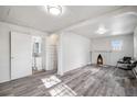 Spacious living room with a fireplace and hardwood floors at 2801 W Dartmouth Ave, Denver, CO 80236
