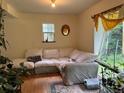 Spacious living area featuring a large sectional sofa and plenty of natural light at 106 Brook Rd, Evergreen, CO 80439