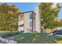 Townhouse exterior with landscaping and parking area visible at 14904 E Hampden Cir # C7, Aurora, CO 80014