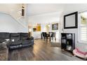 Open living room with hardwood floors and access to kitchen at 7373 E Iowa Ave # 1101, Denver, CO 80231