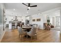 Open concept dining area with hardwood floors and kitchen views at 42970 Colonial Trl, Elizabeth, CO 80107