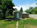 Backyard with detached workshop and grassy area at 1272 N Ulster St, Denver, CO 80220