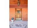 Ornate wood front door with a stained glass window, welcoming entryway at 965 N Pennsylvania St, Denver, CO 80203