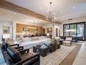 Open-concept living area with a modern kitchen and fireplace at 27 Boulder Cir, Breckenridge, CO 80424