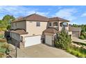 Two-story home with three car garage and driveway at 10215 W Wesley Dr, Lakewood, CO 80227