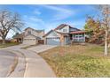 Two-story houses on a residential street with yards at 9451 Garden Ct, Highlands Ranch, CO 80126