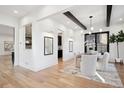 Bright dining room with hardwood floors and modern chandelier at 457 S Vine St, Denver, CO 80209
