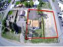 Aerial view of a property with a house and large fenced lot at 15360 W 44Th Ave, Golden, CO 80403