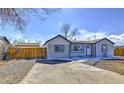 Newly remodeled home with a large yard and driveway at 15360 W 44Th Ave, Golden, CO 80403
