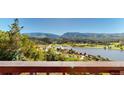 Panoramic view of lake, golf course and mountains at 6301 Perry Park Blvd # 13, Larkspur, CO 80118