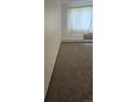 Spacious living room with large window and carpet at 600 S Clinton St # 3A, Denver, CO 80247