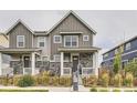 Two story home with gray siding and stone accents at 21974 E 9Th Pl, Aurora, CO 80018