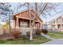 Two-story home with stone accents and mature trees at 12955 Vallejo Cir, Westminster, CO 80234