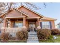 House exterior showcasing a charming front porch at 12955 Vallejo Cir, Westminster, CO 80234