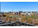 Stunning balcony view overlooking a park and cityscape with mountains in the distance at 1620 Little Raven St # 504, Denver, CO 80202