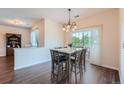 Bright dining area with hardwood floors and access to a deck at 13899 Legend Trl # 103, Broomfield, CO 80023