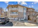 Exterior view of building with parking at 930 E Plum Creek Pkwy # 206, Castle Rock, CO 80104