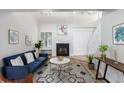 Bright living room with fireplace, and stylish furnishings at 228 S Nome St, Aurora, CO 80012