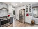 Modern kitchen with stainless steel appliances and white shaker cabinets at 9820 Bucknell Way, Highlands Ranch, CO 80129