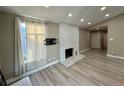 Spacious living room with fireplace and large windows at 3414 S Locust St # D, Denver, CO 80222