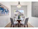 Bright dining area featuring a glass table and four chairs at 8200 E 8Th Ave # 8101, Denver, CO 80230