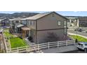 Two-story house exterior with backyard, pergola, and fence at 2688 Loon Cir, Castle Rock, CO 80104