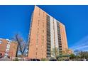 High-rise apartment building with balconies and ample parking at 955 Eudora St # 505E, Denver, CO 80220