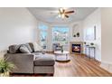 Spacious living room featuring a fireplace and plenty of natural light at 5726 N Genoa Way # 10-106, Aurora, CO 80019