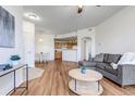 Open living room and kitchen area at 5726 N Genoa Way # 10-106, Aurora, CO 80019