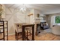 Dining area with table and chairs, adjacent to the kitchen at 1885 S Quebec Way # H15, Denver, CO 80231