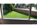 View of a grassy backyard from a balcony at 2231 Sable Blvd # 912, Aurora, CO 80011