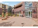 Community center entrance with landscaping and bike rack at 3601 Arapahoe Ave # 226, Boulder, CO 80303