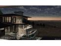 Night view of home's exterior showcasing deck and city views at 63 Canyon Pines Dr, Arvada, CO 80403