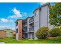 Exterior view of a three-story condominium building with landscaping at 50 19Th Ave # 84, Longmont, CO 80501