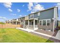 Spacious backyard with a large patio and grassy area at 26346 E Canal Pl, Aurora, CO 80018