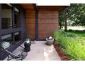 Modern patio with seating area, water feature, and lush landscaping at 2270 S Jackson St, Denver, CO 80210