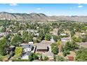 House nestled in a residential neighborhood near mountains at 1070 Rogers St, Golden, CO 80401