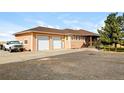 Ranch style home with attached three-car garage and spacious driveway at 35100 E 120Th Ave, Hudson, CO 80642