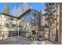 Gray two-story home with attached two-car garage at 4888 Silver Spruce Ln, Evergreen, CO 80439