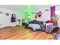 Living room with gray sectional sofa and wood-look floors at 3623 S Sheridan Blvd # T6, Denver, CO 80235