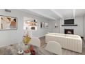 Living room features a fireplace, modern decor and kitchen at 2525 S Dayton Way # 1109, Denver, CO 80231