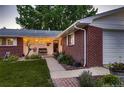 Brick ranch home with charming walkway and landscaping at 2745 S Kendall Way, Denver, CO 80227