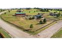 Aerial view showing home, barn, and surrounding land at 2190 Helen Ct, Parker, CO 80138