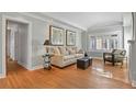 Living room with hardwood floors, a sofa, and chairs at 1529 Holly, Denver, CO 80220