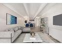 Virtually staged living room with modern furniture and open floor plan at 1265 Race St # 208, Denver, CO 80206