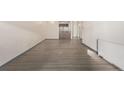 Living room with hardwood floors and open kitchen view at 1265 Race St # 208, Denver, CO 80206