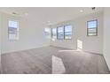 Spacious bedroom with wall-to-wall carpeting and large windows at 3174 S Russell St, Morrison, CO 80465