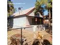 House exterior with chain link fence at 2831 Lawrence St, Denver, CO 80205