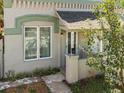 Charming bungalow exterior featuring a front porch and well-maintained landscaping at 4768 Claude Ct, Denver, CO 80216